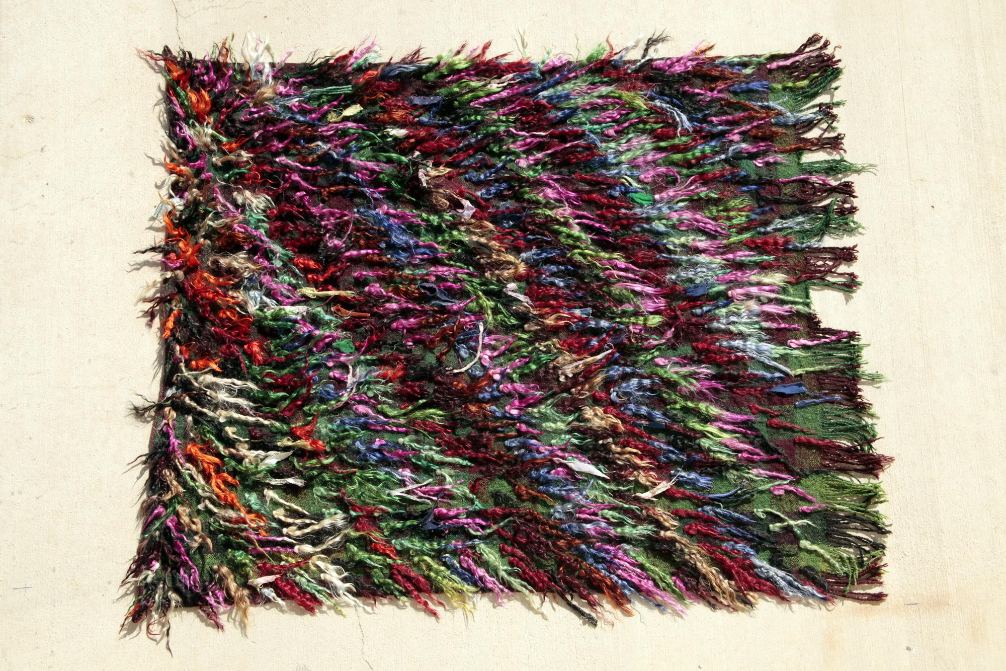 textile wall art with layered stitches and texture